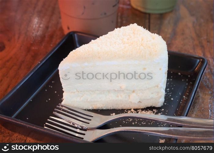 Closeup cheese cake on black plate, stock photo