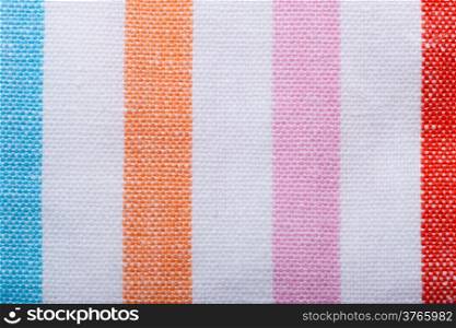 Closeup colorful striped fabric textile as background texture or stripe pattern. Macro.