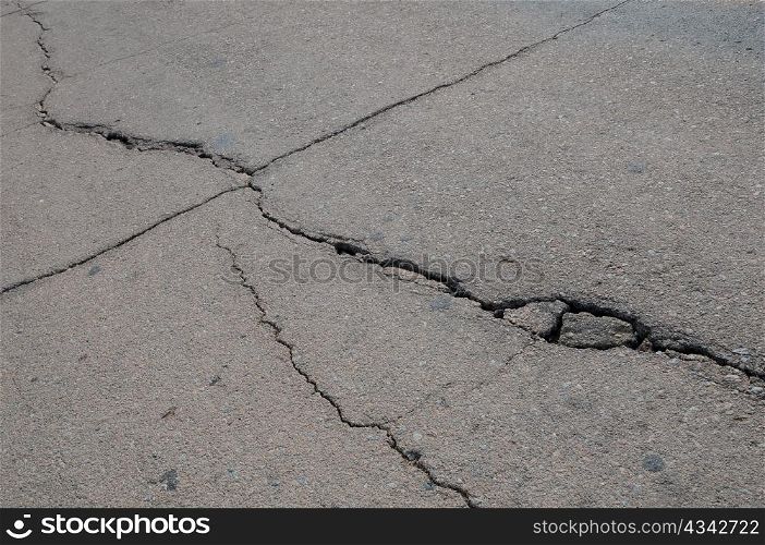 Closeup cracks on asphalt pavement