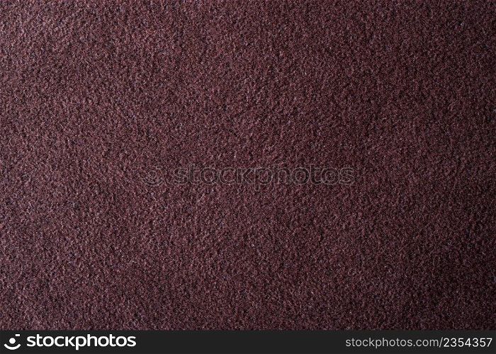 Closeup dark brown suede soft leather as texture background