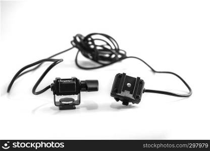 Closeup detail of a professional flash cord connector for photographer with a didital dslr camera, isolated on white background.. Closeup detail of a professional flash cord connector for photographer with a didital dslr camera, isolated on white background