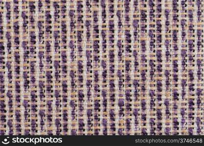 Closeup detail of a purple sisal carpet texture background.