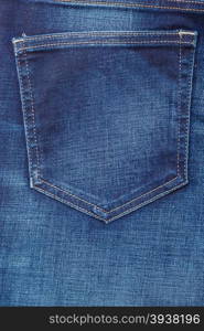 closeup detail of blue denim jeans trouses pocket, texture background