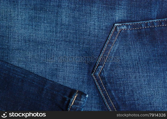 closeup detail of blue denim jeans trouses pocket, texture background