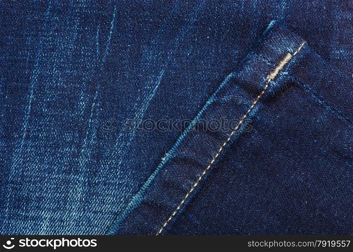 closeup detail of blue denim jeans trouses , texture background