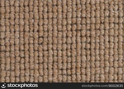 Closeup detail of brown carpet texture background.