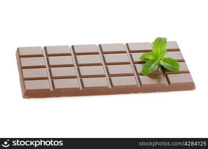 Closeup detail of chocolate and mint leaves on white background.