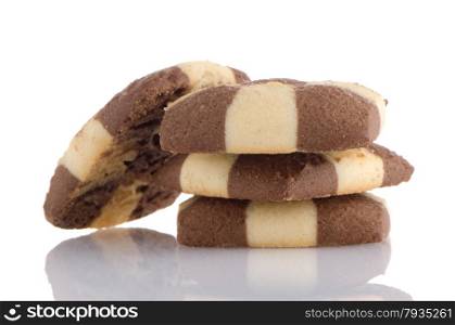 Closeup detail of delicious butter and chocolate cookies on white reflective background.