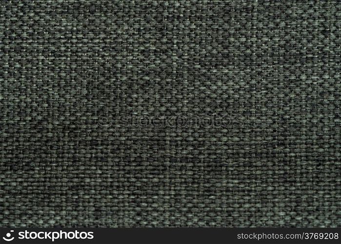 Closeup detail of green fabric texture background.