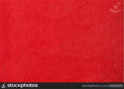 Closeup detail of red fabric texture background.