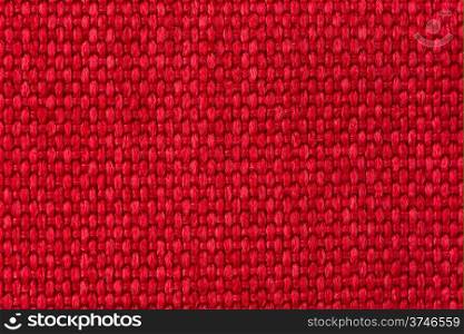 Closeup detail of red woven texture background.