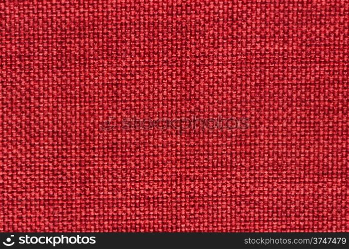 Closeup detail of red woven texture background.