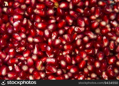 Closeup detail of the fresh pommegranate grains backdrop