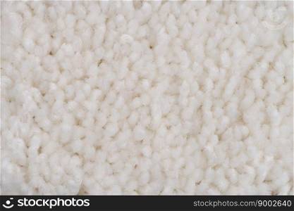 Closeup detail of White carpet texture background.