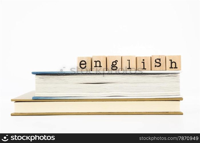 closeup english wording stack on books. english for foreigner, tutorial and learning concept and idea.