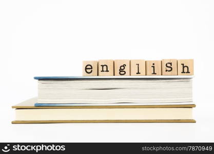 closeup english wording stack on books. english for foreigner, tutorial and learning concept and idea.