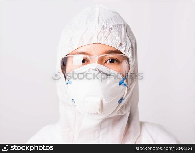 Closeup face of portrait woman doctor or scientist in PPE suite uniform wearing face mask N95 protective and eyeglasses in lab, coronavirus or COVID-19 concept isolated white background