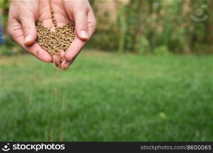 Closeup Farmer Hands Spreading Organic Universal Fertilizer