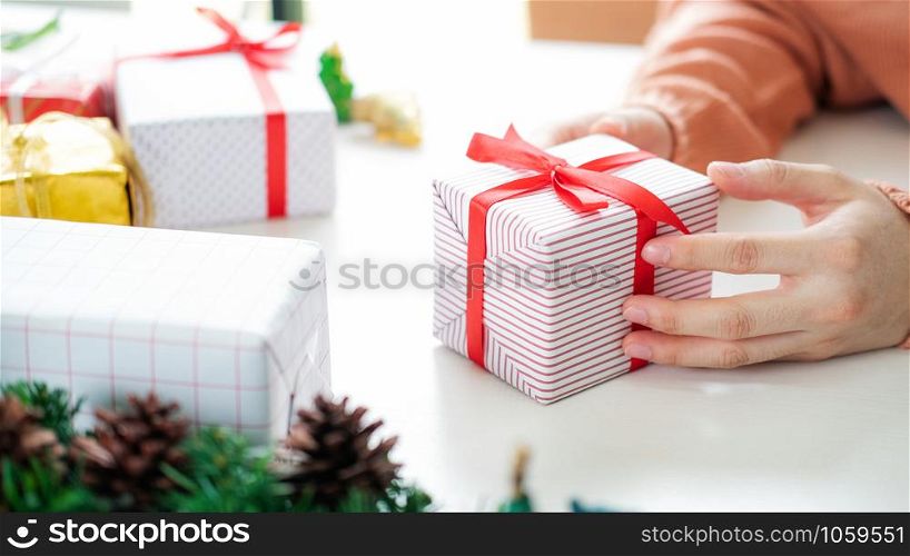 Closeup female hands holding gift box. Christmas Birthday and Happy New Year concept.