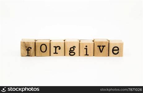 closeup forgive wording isolate on white background, ethic and merit concept and idea