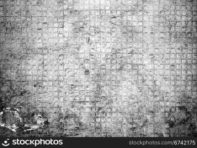 Closeup fragment of grungy weathered wall of a building