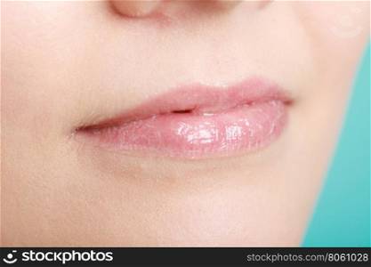Closeup glossy female lips. Part of face.. Closeup shiny glossy female lips. Part of face.