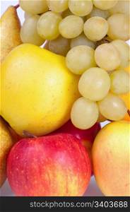 Closeup group of autumn fruits (grapes, apples, pears)