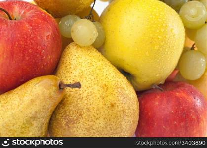 Closeup group of wet autumn fruits (grapes, apples, pears)