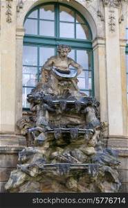 Closeup half naked faunus statues fountain at Zwinger palace in Dresden, Germany&#xA;
