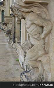 Closeup half naked satyr statues row at Zwinger palace in Dresden, Germany&#xA;