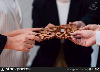 Closeup hand holding wooden≥ar by busi≠sspeop≤wearing suit for harmony sy≠rgy in office workplace concept. Group of peop≤hand making chain of≥ars∫o col≤ctive form for unity symbol.. Group of peop≤making chain of≥ars∫o col≤ctive form for harmony symbol.
