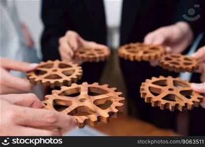 Closeup hand holding wooden gear by businesspeople wearing suit for harmony synergy in office workplace concept. Group of people hand making chain of gears into collective form for unity symbol.. Group of people making chain of gears into collective form for harmony symbol.