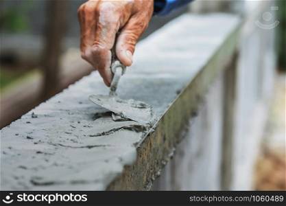 closeup hand of worker are plastering