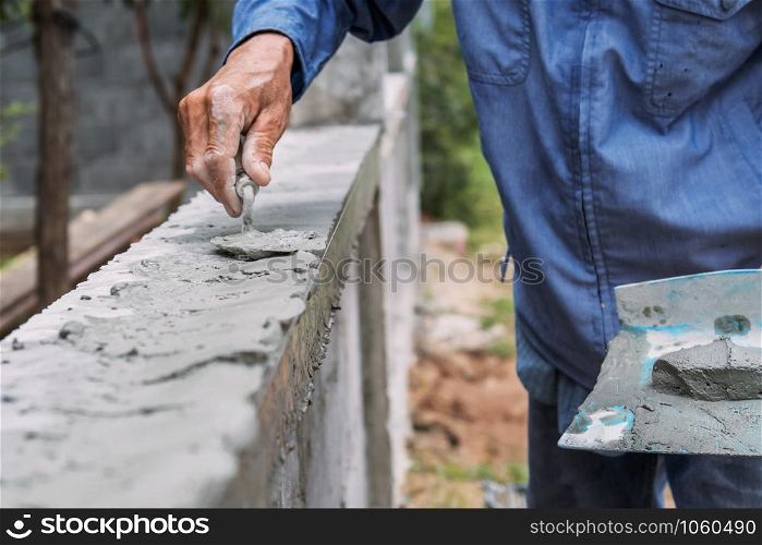 closeup hand of worker are plastering