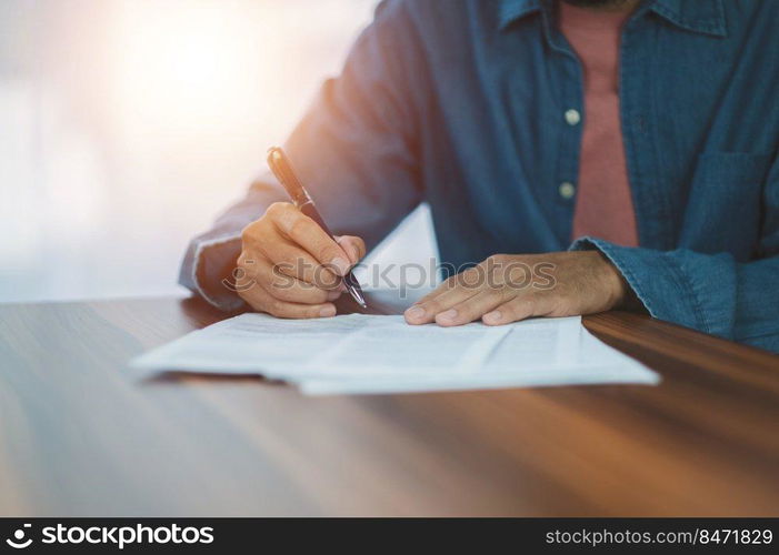 Closeup hand sign on document,  signature contract executive