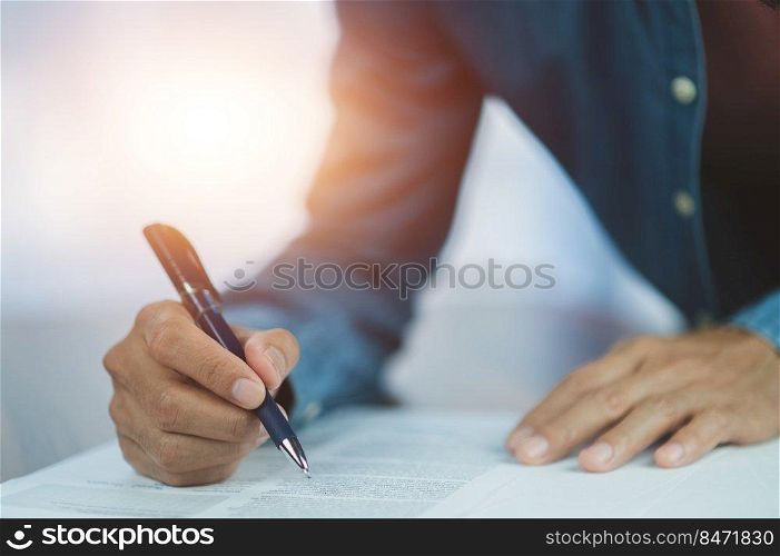 Closeup hand sign on document,  signature contract executive