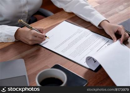 Closeup hand signing contract document with pen, sealing business deal with signature. Businesspeople finalizing business agreement by writing down signature on contract paper. Enthusiastic. Closeup hand signing contract document with pen. Enthusiastic.