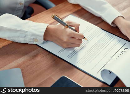 Closeup hand signing contract document with pen, sealing business deal with signature. Businesspeople finalizing business agreement by writing down signature on contract paper. Enthusiastic. Closeup hand signing contract document with pen. Enthusiastic.