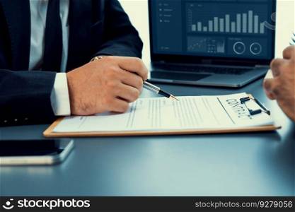 Closeup hand signing contract document with pen, sealing business deal with signature. Businesspeople finalizing business agreement by writing down signature on contract paper. Fervent. Closeup hand signing contract document with pen. Fervent.
