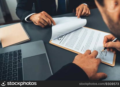 Closeup hand signing contract document with pen, sealing business deal with signature. Businesspeople finalizing business agreement by writing down signature on contract paper. Fervent. Closeup hand signing contract document with pen. Fervent.