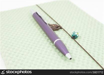 Closeup handmade notebook with pen isolated on white background, stock photo