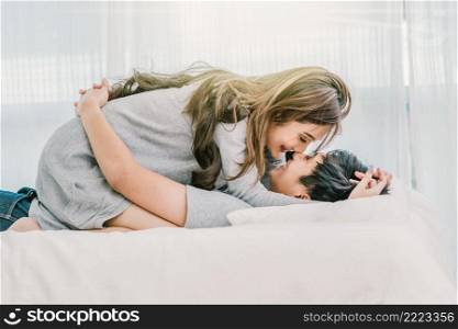 Closeup Happy Asian Lover kissing and hugging on the bed in bedroom at modern home, Couple and life style concept,
