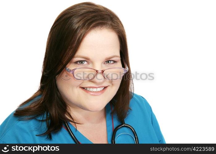Closeup headshot of a friendly, beautiful nurse. Isolated on white.