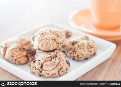 Closeup healthy cookies on white plate with coffee cup, stock photo