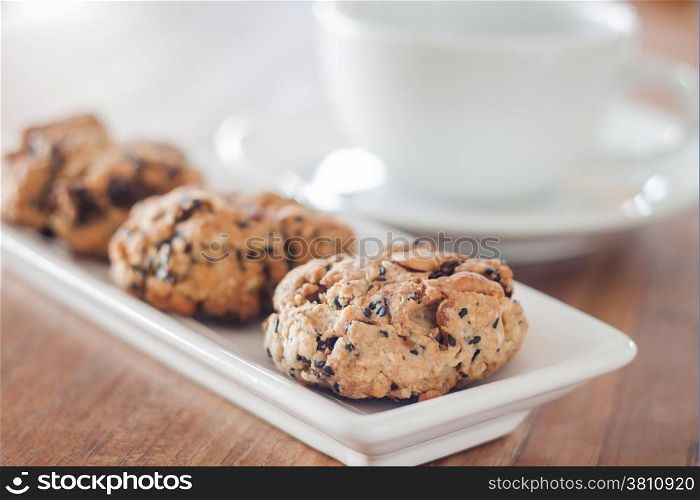 Closeup healthy cookies with coffee cup, stock photo