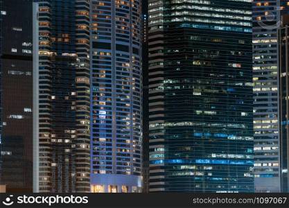Closeup Hong Kong Cityscape skyscraper at night time, business financial district, tourist and travel destination, architecture building and landmark concept