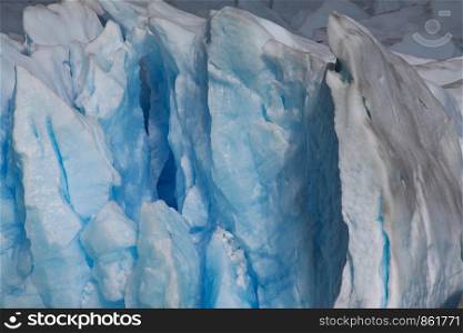 Closeup iceberg of glacier with detail of crystal and tree