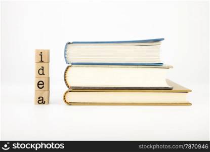 closeup idea wording and books isolate on white background, concept and idea for education and business