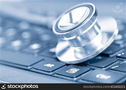 closeup if a stethoscope on a computer keyboard