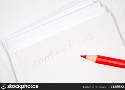 Closeup image of pencil on sheet of notepad